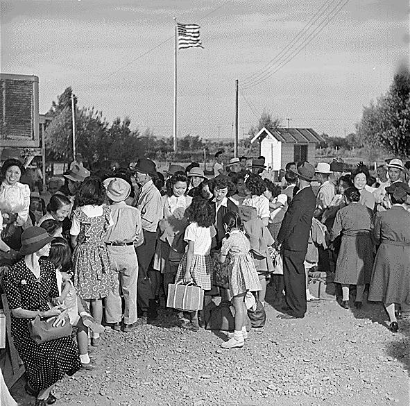 Photo of Incarcerated Japanese preparing to return to their homes from Poston. September 1945. Hikaru Iwasaki. Public Domain.